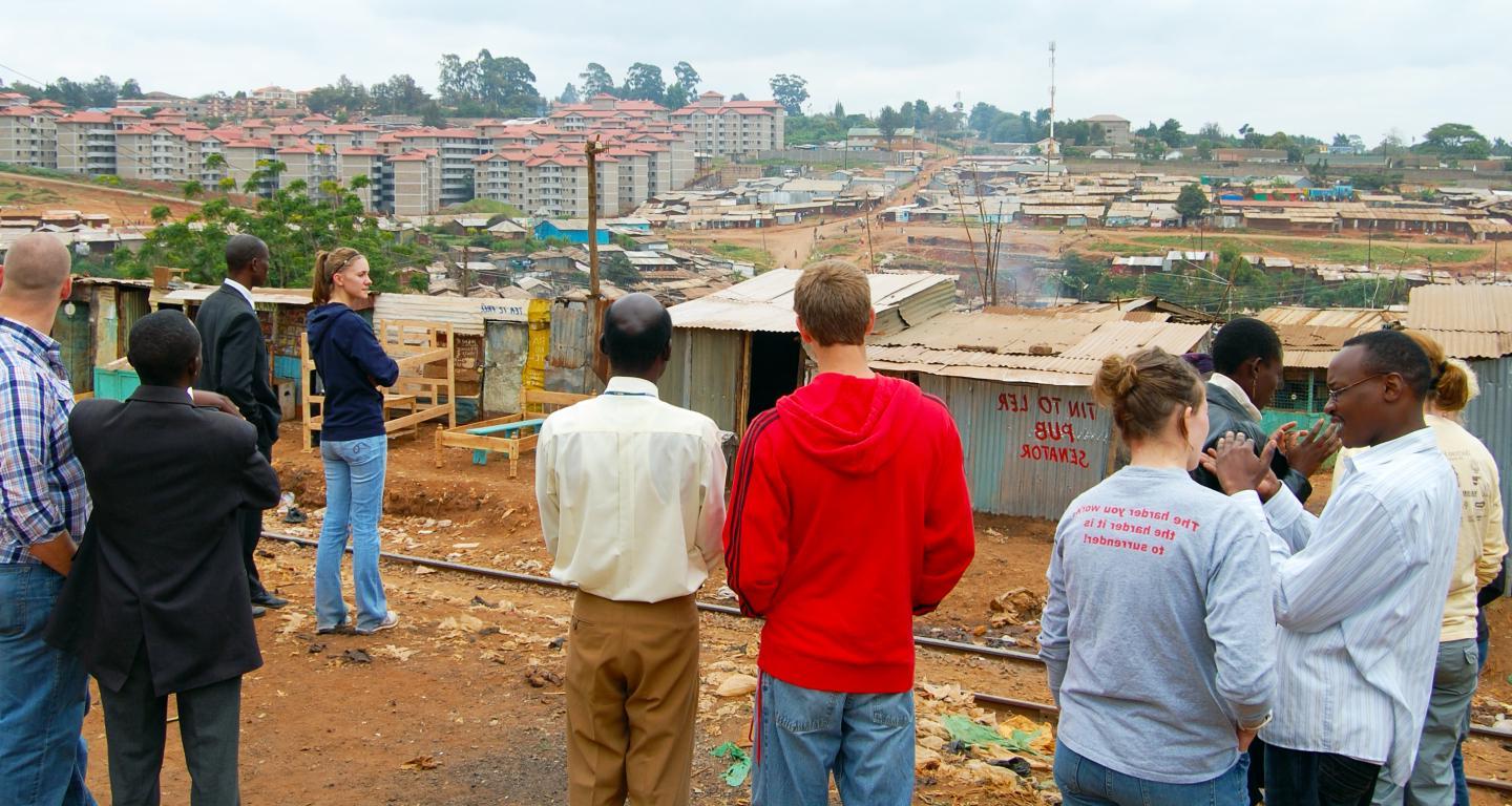 学生 looking over a village on a service trip.