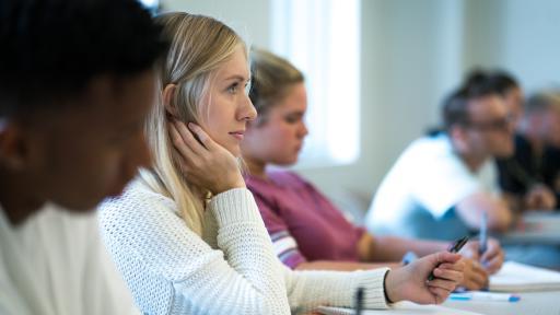 students in class taking notes